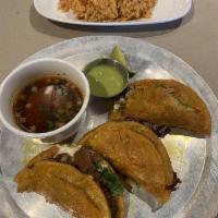 Birria Tacos · Corn tortillas with Mexican beef. Slow cooked., Mexican cheese blend, cilantro, onions, dipp...
