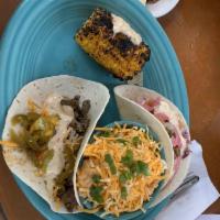 Velvet Steak Taco · Fajita steak, Monterey Jack and amp; cheddar cheese, mango salsa and topped with chipotle ai...