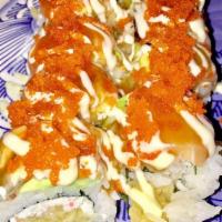 Dragon Roll · Shrimp tempura, crab mix, white fish, salmon, unagi, avocado, masago and sauce.