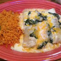 Chicken Enchiladas · 3  shredded chicken enchiladas topped with sour cream sauce and melted cheese.