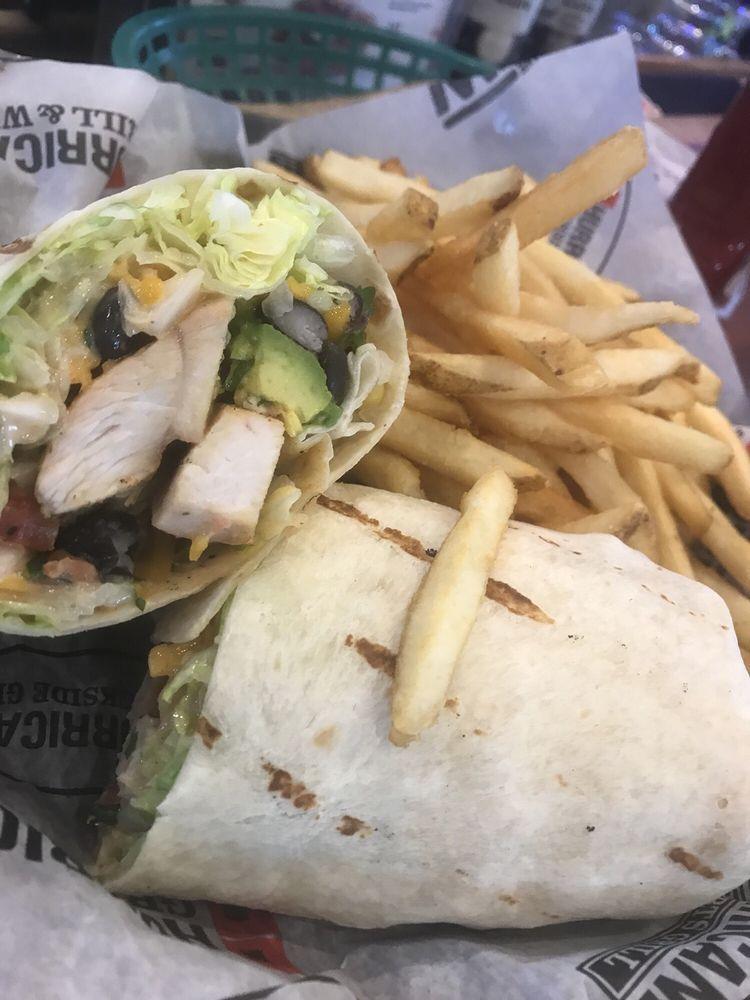 Cancun Chicken Wrap · Grilled or crispy diced chicken breast, shredded cheddar jack cheese, lettuce, tomatoes and crispy tortilla strips tossed in a Sriracha ranch dressing and wrapped in a flour tortilla.