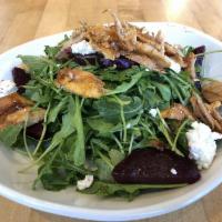Arugula and Beet Salad Bowl · Arugula, roasted red beets, goat cheese in pomegranate dressing. Vegetarian and gluten free.