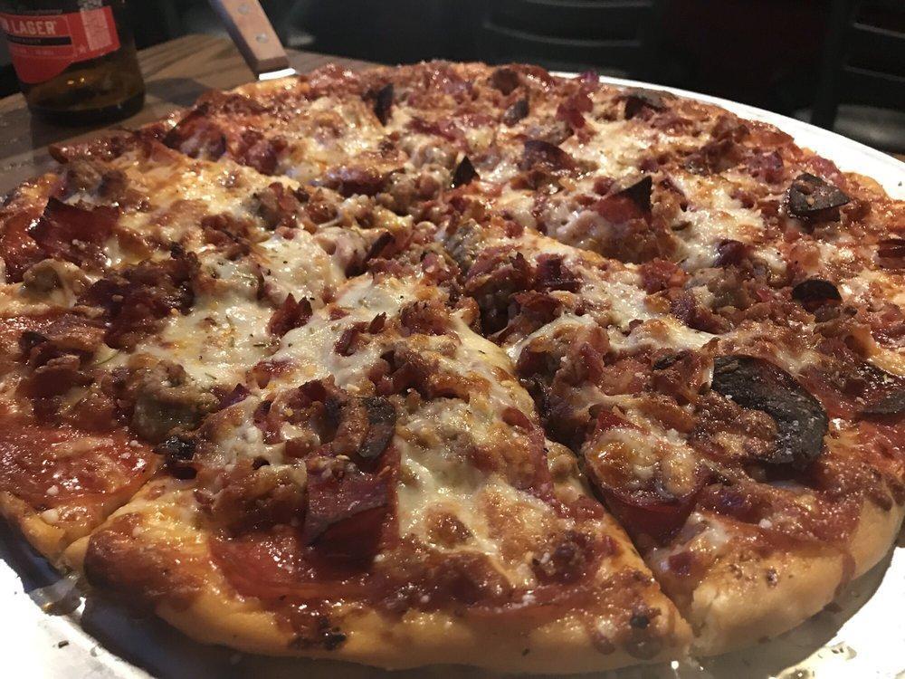 Bypass Pizza · Pizza sauce, pepperoni, Italian sausage, capicola ham, hard salami, bacon and extra mozzarella.