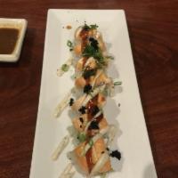 Genki Roll · Crab meat, avocado and cucumber topped with baked salmon, tobiko, and green onion.