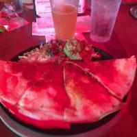 Chicken Quesadilla · Flour tortilla loaded with Monterey Jack cheese & tender chicken breast. Served with pico de...