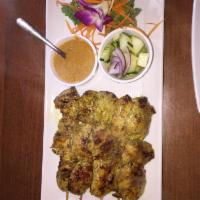 Chicken Satays · Chicken skewers marinated in herbs, spices, yellow curry powder served with peanut sauce and...