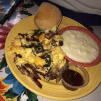 Southern Scramble · Three eggs scrambled with choice of bacon, spicy vegan collard greens, onions, and yellow ch...