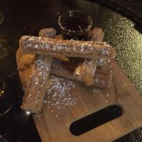 Churros · Fried Dough filled with Cajeta covered in sugar and cinnamon served with chocolate