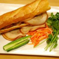 Pork Belly · Simmered pork, hoisin sauce and soy sauce.Served on a toasted French baguette made from scra...