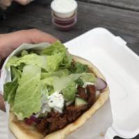 Beef and Lamb Gyro · Sandwiches come with lettuce, tomato, cucumber and sauce. A dip made from cooked, mashed chi...