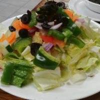 Garden Salad · Lettuce, red onions, tomato, cucumber, carrots, green pepper, and black olives.

