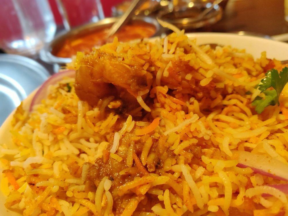 Shrimp Biryani · An aromatic mixture of basmati rice, shrimp, saffron, herbs and spices, served with raita and mirchi-ka-salan