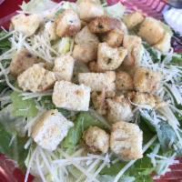 Caesar Salad · Romaine lettuce topped with shaved Parmesan and croutons.