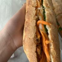 Lemongrass Chicken Sandwich · Sweet baguette, carrots, daikon, red onion, English cucumber, cilantro, jalapeno and aioli.