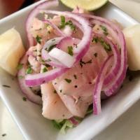 Ceviche · Tender white fish marinated with fresh lime juice, onions and cilantro.