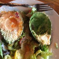 Alligator Pears Salad · Avocado halves filled with our special house dressing, served over a bed of fresh greens wit...