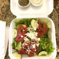 Greek Salad · A blend of lettuce, tomatoes, onions, red and green peppers, cucumber, feta cheese, Kalamata...