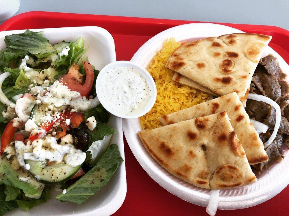 Gyro Plate · Seared layers of select beef and lamb perfectly seasoned with zesty spices, broiled on a vertical skewer, thinly sliced and served with rice, pita bread. Greek salad with onions, tomatoes, and our famous tzatziki sauce.