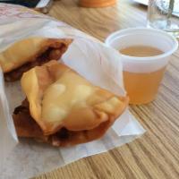 Crab Rangoon · Homemade wonton filled with cream cheese, crab meat, chopped onion served with pineapple sau...