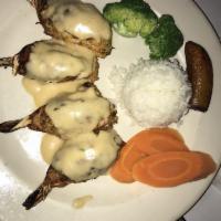 Stuffed Shrimp with Crabmeat · 4  jumbo shrimp stuffed with crab meat and topped with a special seafood sauce.