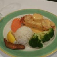 Salmon Primavera · 8 oz. mesquite grilled fillet of salmon topped with shrimp and scallops in a white wine sauc...
