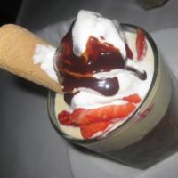 Budino · Chocolate ganache, vanilla sauce, whipped cream and strawberries. Gluten free.