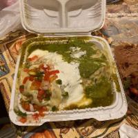 Wet Burrito · Rice, beans, onions, cilantro, topped with red or green sauce, cheese, sour cream, avocado a...