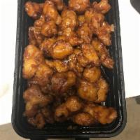 Honey Glazed Chicken with Orange Zest · A winning combination of tender chicken coated with a light golden brown batter and glazed w...