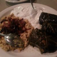 Bademjan · Fried eggplant cooked with beefstew in tomato sauce served with fluffy basmati rice.