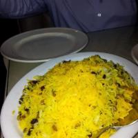 Adas Polo · Fluffy basmati rice mixed with lentils, dates and raisins.