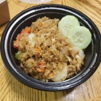 Kao Pad Kra Pow · Thai style fried rice with fresh basil, Thai chili, bell pepper, and onion in brown sauce. 