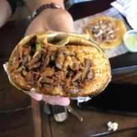 Al Pastor Burritos · Marinated roast pork. Served with refried beans, rice, onions, cilantro on a large flour tor...