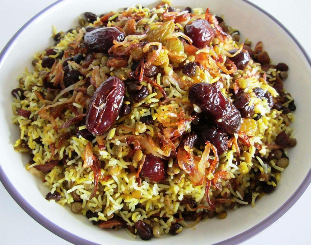 Lentil Rice · Cooked lentils mixed with basmati rice, raisins, fried onions, topped with pitted dates for an amazing taste.