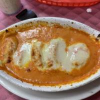 Lobster Ravioli · Ravioli stuffed with lobster cooked with creamy pink sauce and baked with mozzarella and pro...