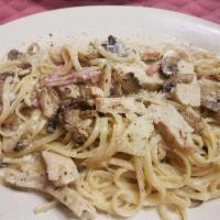 Chicken Carbonara · Grilled chicken with creamy white wine sauce with chopped ham and mushrooms with linguini pa...