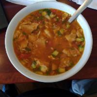 Tortilla Soup · Soup made with fried corn tortilla and seasoned tomato broth. 