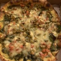 Greek Pizza · Spinach, tomatoes, green olives, pesto sauce, feta and mozzarella cheese.