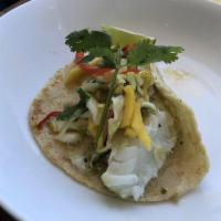 Fish Tacos · Cod, habanero tartare sauce, mango slaw and fresh tortillas.
