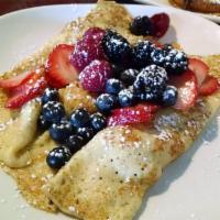 Crepes · 3 plain crepes dusted with powdered sugar. Scratch recipe french crepes. Served with whipped...