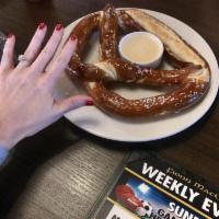 Giant Pretzel · Jumbo pretzel served with our specialty 3 cheese dip.