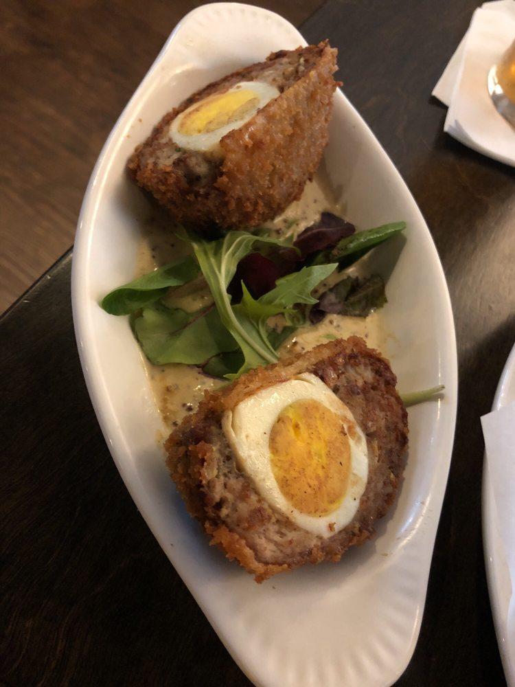Scotch Egg · Hardboiled egg wrapped in seasoned sausage, breaded, deep-fried and served with Dijon mustard sauce.