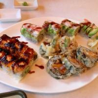 Wasabi Roll · With shrimp, unagi, tamago, fresh asparagus and tobiko inside, whole roll fried and drizzled...