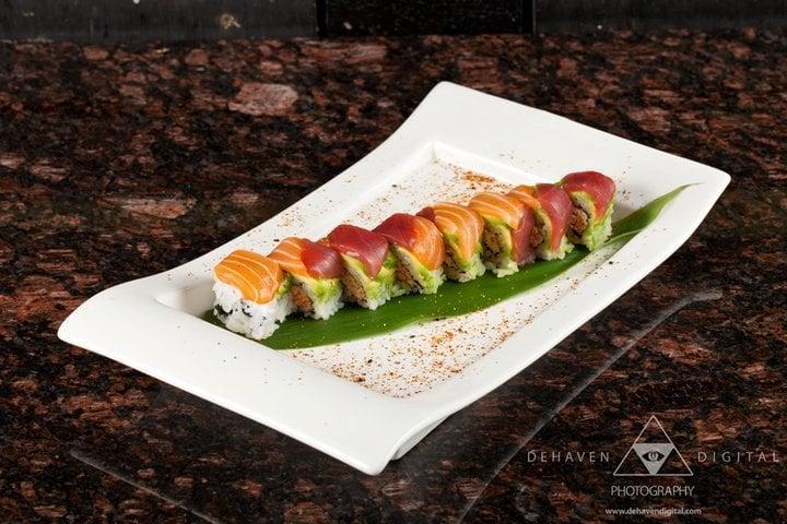 Manhattan Roll · Spicy crabmeat on the inside topped with avocado, tuna and salmon.