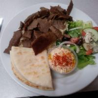 Lamb and Beef Gyro Pita · Slowly roasted on vertical rotisserie, sliced thin, topped with tomatoes, red onions and Tza...