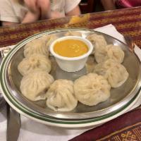 Chicken Momo · Steamed chicken dumpling mildly spiced with ginger, garlic, onion, and spices served with ho...