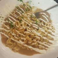 Swedish Meatballs · Served in our homemade sauce on a bed of egg noodles. Choice of 1 side.