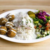 Falafel Plate · Basmati rice plate with falafel, toppings and sauce. Served with pita (or tell us to skip it...