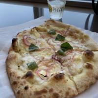 Limone Pizza · Olive oil base, garlic, five cheeses, sliced lemons, red onion and basil.
