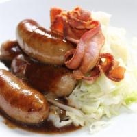 Belmullet Bangers and Mash · Jumbo sausage simmered in our homemade gravy. Served with mashed potatoes and beer braised r...