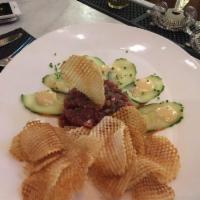 Tuna Tartare · Sliced cucumber, potato chips, ginger aioli, Thai vinaigrette.